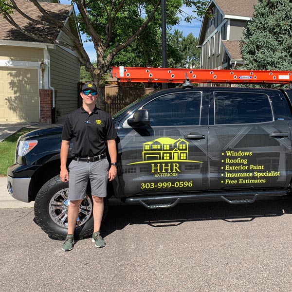 Ryan Sharp in front of HHR truck